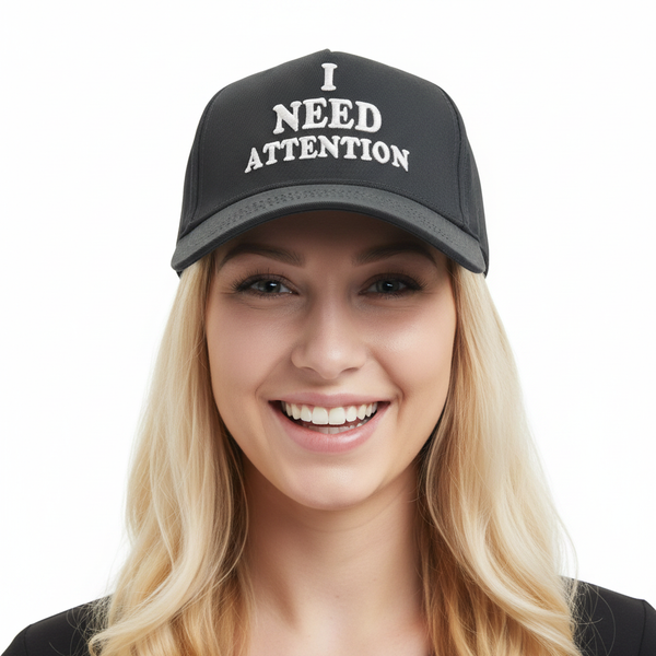 Cute blonde girl wearing I Need Attention cap