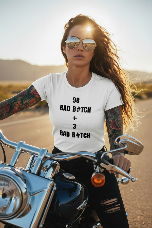 Fierce tattooed woman on a Harley wearing the 98 Bad B#tch graphic tee